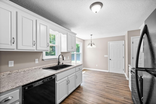 1155 Delmont Church Rd, Cadiz, KY 42211 - kitchen with black appliances, wood finished floors, white cabinets, a textured ceiling, and a chandelier