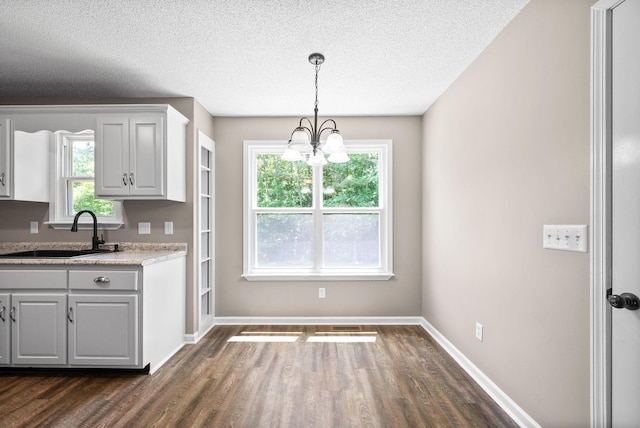 1155 Delmont Church Rd, Cadiz, KY 42211 - kitchen with dark wood-style floors, light countertops, a textured ceiling, decorative light fixtures, and a chandelier
