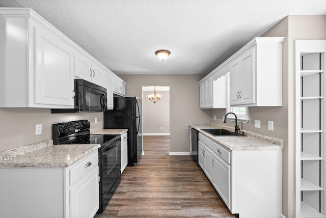 1155 Delmont Church Rd, Cadiz, KY 42211 - kitchen featuring black appliances, a chandelier, white cabinetry, dark wood-type flooring, and a textured ceiling