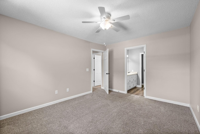 1155 Delmont Church Rd, Cadiz, KY 42211 - unfurnished bedroom with carpet flooring, a textured ceiling, ensuite bathroom, and a ceiling fan
