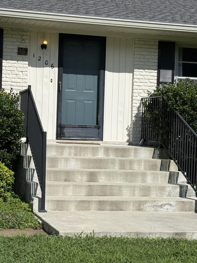 1206 Park Mere Dr, Columbia, TN 38401 - view of exterior entry with a shingled roof and brick siding