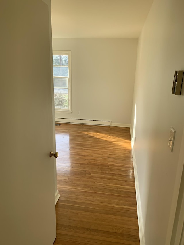 1206 Park Mere Dr, Columbia, TN 38401 - corridor featuring a baseboard radiator and wood finished floors