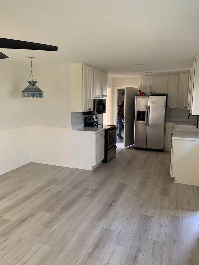 1206 Park Mere Dr, Columbia, TN 38401 - kitchen featuring stainless steel fridge, electric range, light wood-style floors, and light countertops