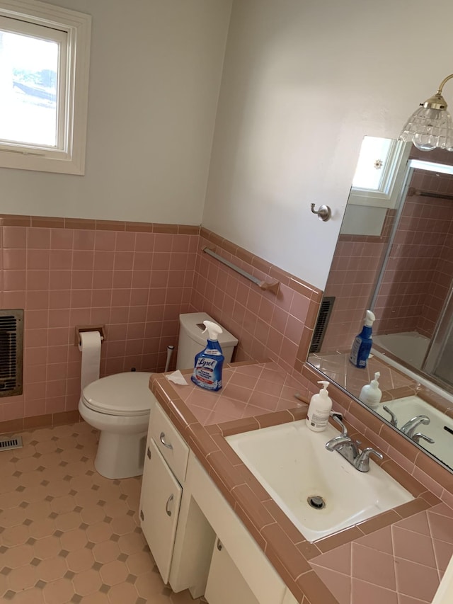 1206 Park Mere Dr, Columbia, TN 38401 - full bathroom with tile walls, heating unit, wainscoting, vanity, and tile patterned floors