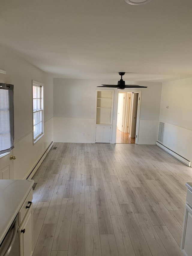 1206 Park Mere Dr, Columbia, TN 38401 - spare room featuring a baseboard radiator, a ceiling fan, and light wood-style floors