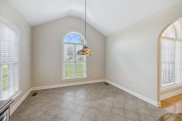 6913 Zion Crossing Ct, Columbia, TN 38401 - unfurnished dining area featuring lofted ceiling, arched walkways, and light tile patterned floors