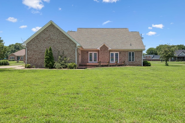 6913 Zion Crossing Ct, Columbia, TN 38401 - new england style home featuring french doors, a front yard, and brick siding