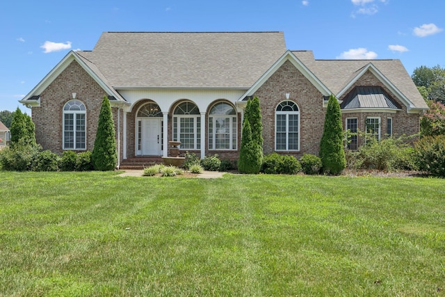 6913 Zion Crossing Ct, Columbia, TN 38401 - view of front of house featuring brick siding, a front lawn, and roof with shingles