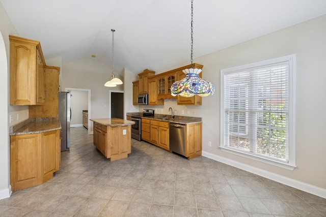 6913 Zion Crossing Ct, Columbia, TN 38401 - kitchen with stainless steel appliances, healthy amount of natural light, a center island, lofted ceiling, and light stone counters