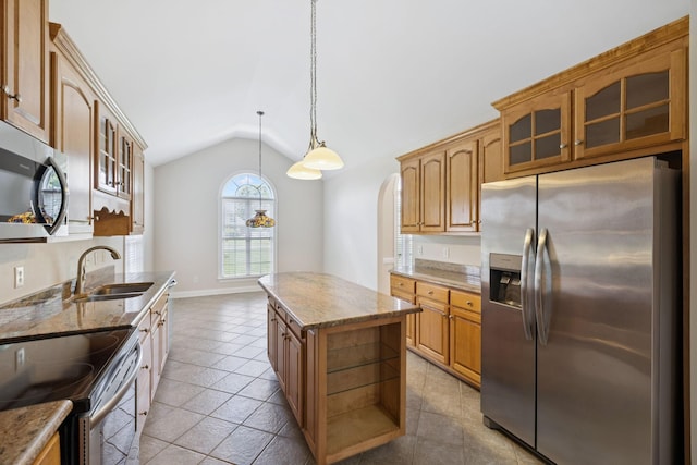 6913 Zion Crossing Ct, Columbia, TN 38401 - kitchen featuring appliances with stainless steel finishes, lofted ceiling, a center island, light stone counters, and glass insert cabinets
