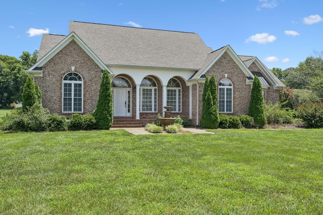 6913 Zion Crossing Ct, Columbia, TN 38401 - view of front of property featuring brick siding, roof with shingles, and a front lawn