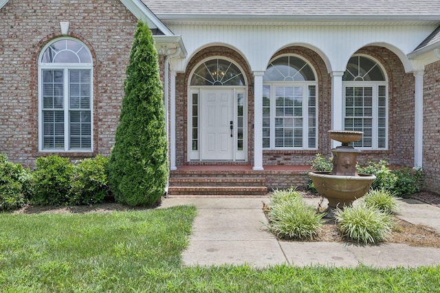 6913 Zion Crossing Ct, Columbia, TN 38401 - view of exterior entry featuring brick siding and roof with shingles
