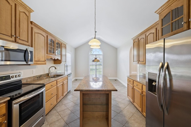 6913 Zion Crossing Ct, Columbia, TN 38401 - kitchen featuring stainless steel appliances, vaulted ceiling, light stone counters, a center island, and glass insert cabinets