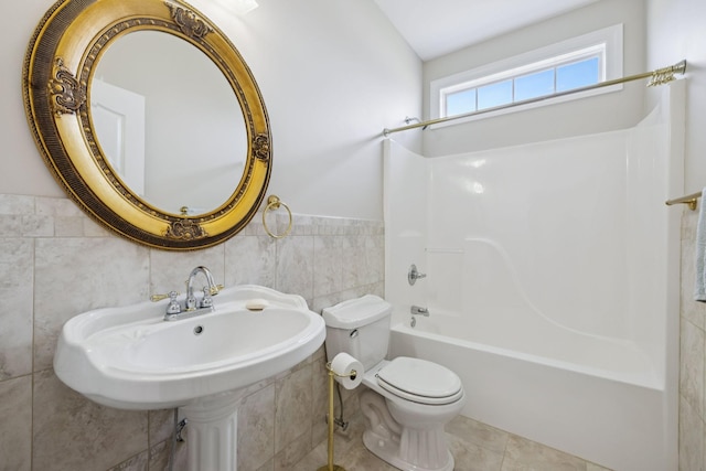 6913 Zion Crossing Ct, Columbia, TN 38401 - bathroom featuring tile walls, shower / bath combination, and a wainscoted wall