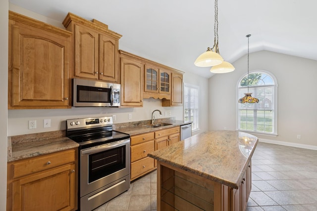 6913 Zion Crossing Ct, Columbia, TN 38401 - kitchen featuring stainless steel appliances, lofted ceiling, light tile patterned flooring, a center island, and light stone counters