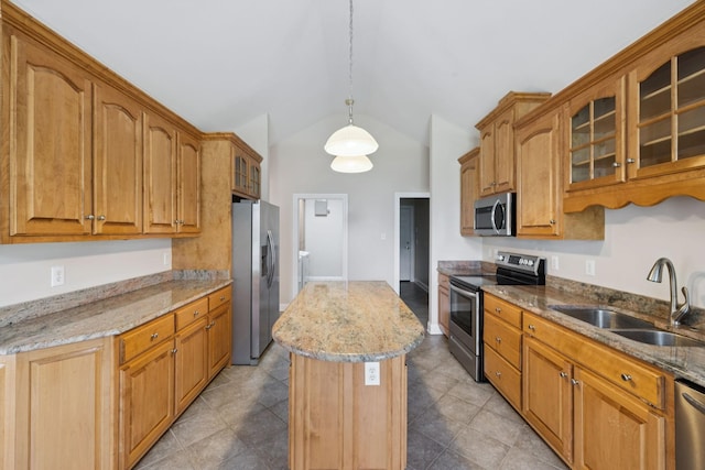 6913 Zion Crossing Ct, Columbia, TN 38401 - kitchen with stainless steel appliances, a kitchen island, vaulted ceiling, light stone counters, and glass insert cabinets