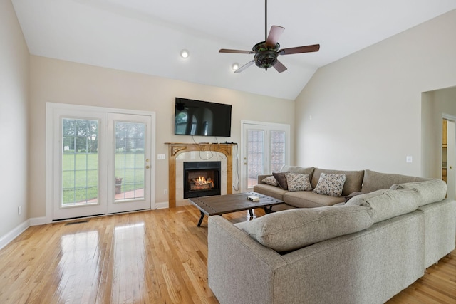6913 Zion Crossing Ct, Columbia, TN 38401 - living area featuring light wood-style floors, a high end fireplace, a ceiling fan, and vaulted ceiling