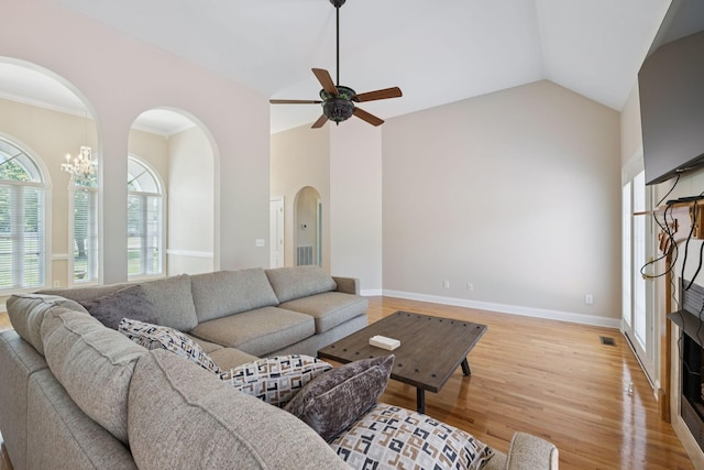 6913 Zion Crossing Ct, Columbia, TN 38401 - living room featuring a ceiling fan, arched walkways, light wood-type flooring, and vaulted ceiling