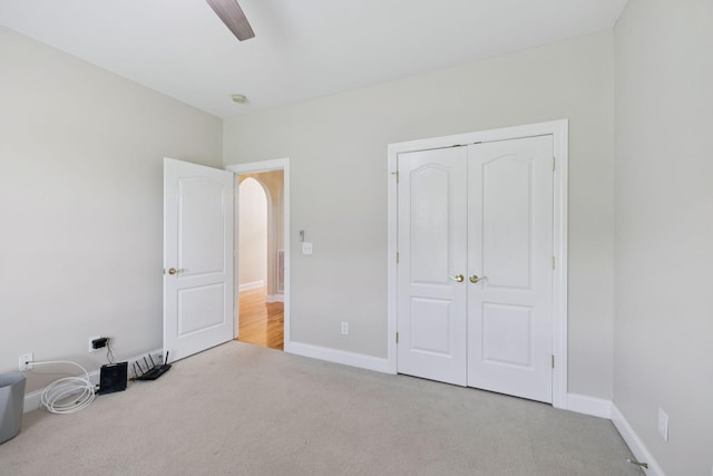 6913 Zion Crossing Ct, Columbia, TN 38401 - unfurnished bedroom with carpet, a closet, ceiling fan, and arched walkways