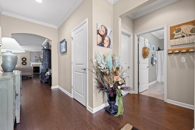 7560 Hampstead Hall Dr, Ooltewah, TN 37363 - entryway with arched walkways, ornamental molding, wood finished floors, and a large fireplace