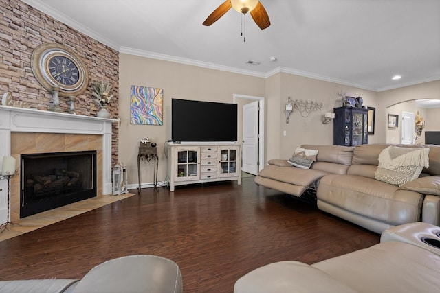 7560 Hampstead Hall Dr, Ooltewah, TN 37363 - living area with ceiling fan, arched walkways, wood finished floors, crown molding, and a tiled fireplace