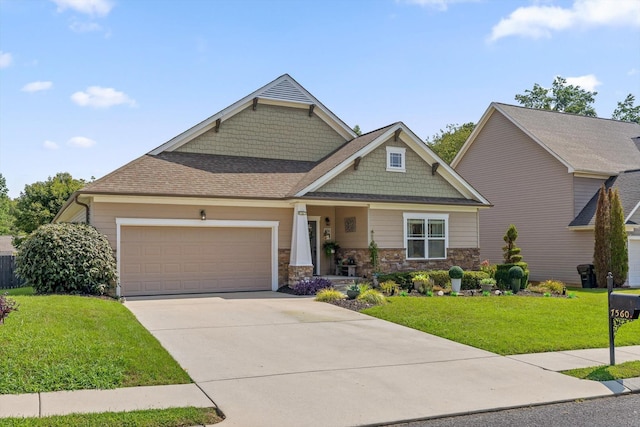 7560 Hampstead Hall Dr, Ooltewah, TN 37363 - craftsman-style house with an attached garage, driveway, a front yard, and stone siding