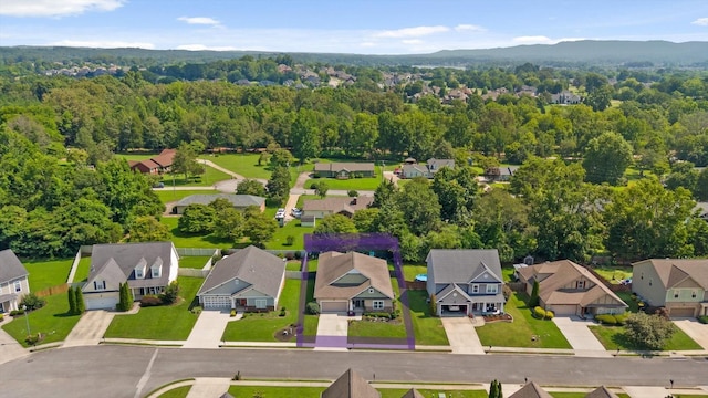 7560 Hampstead Hall Dr, Ooltewah, TN 37363 - aerial perspective of suburban area featuring a mountain backdrop and a forest