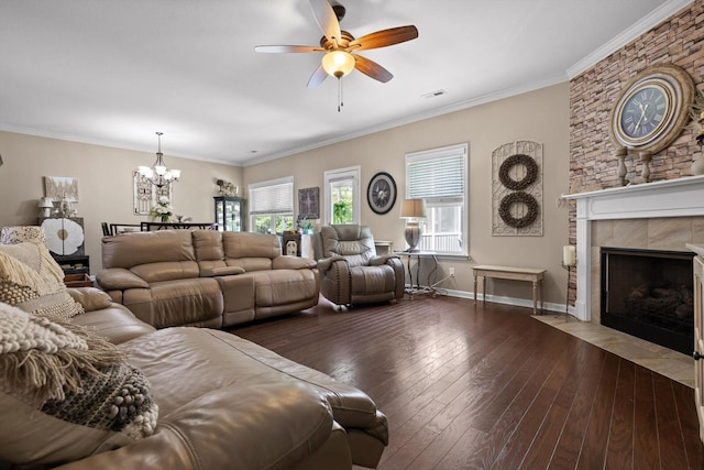 7560 Hampstead Hall Dr, Ooltewah, TN 37363 - living room with wood-type flooring, ceiling fan, a chandelier, a tile fireplace, and ornamental molding