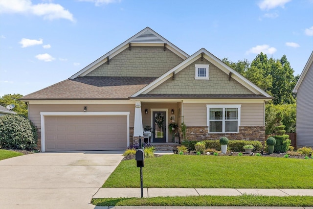 7560 Hampstead Hall Dr, Ooltewah, TN 37363 - craftsman-style house featuring a garage, concrete driveway, a front lawn, and stone siding