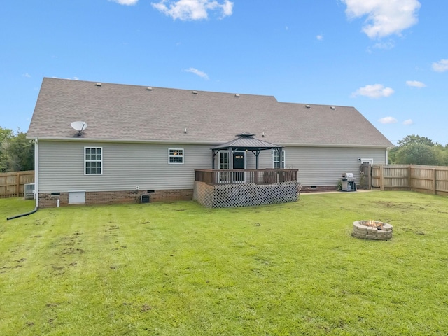 1493 Azalee Ln, Chapel Hill, TN 37034 - back of property with a gazebo, crawl space, an outdoor fire pit, a fenced backyard, and a shingled roof