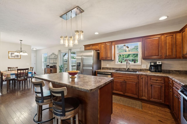 1493 Azalee Ln, Chapel Hill, TN 37034 - kitchen with stainless steel appliances, dark countertops, a chandelier, dark wood finished floors, and recessed lighting