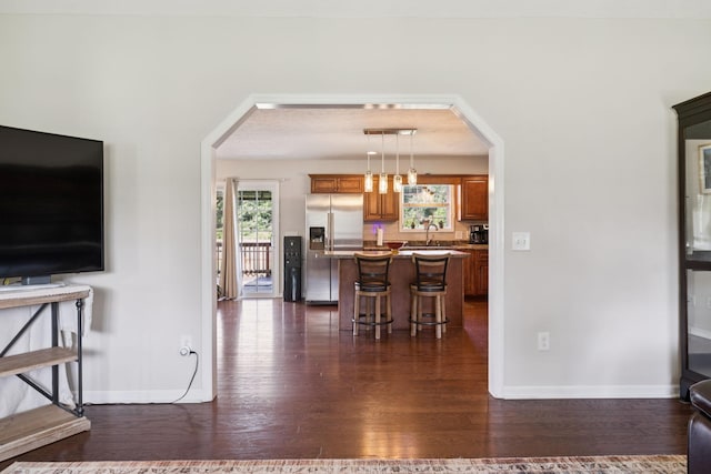 1493 Azalee Ln, Chapel Hill, TN 37034 - living area with arched walkways and dark wood-style flooring