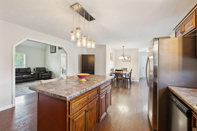 1493 Azalee Ln, Chapel Hill, TN 37034 - kitchen featuring stainless steel appliances, arched walkways, dark wood-style floors, and a center island