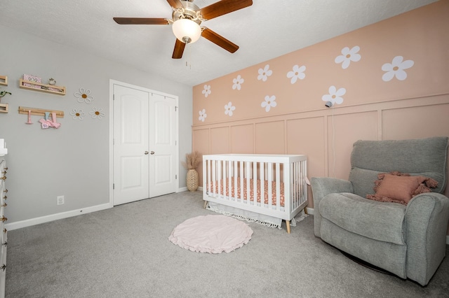 1906 Charismatic Pl, Murfreesboro, TN 37128 - bedroom featuring a closet, a decorative wall, carpet, ceiling fan, and wainscoting