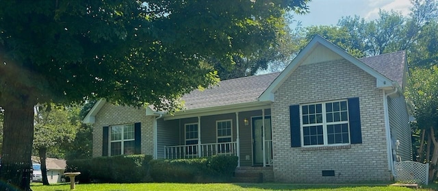 215 Derek Ct, Portland, TN 37148 - view of front of house with a porch, brick siding, and a front yard