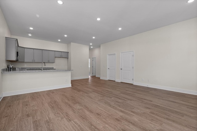 212 Mcbrien Rd, Chattanooga, TN 37411 - unfurnished living room with light wood-style flooring and recessed lighting