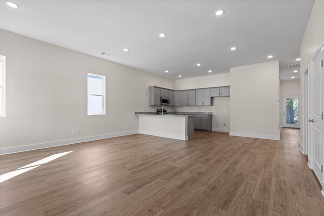 212 Mcbrien Rd, Chattanooga, TN 37411 - unfurnished living room featuring wood finished floors and recessed lighting