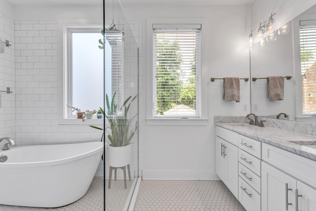 2806 Marlin Ave, Nashville, TN 37215 - full bathroom with double vanity, a freestanding bath, a tile shower, and tile patterned floors