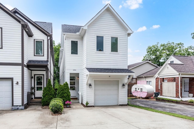 2806 Marlin Ave, Nashville, TN 37215 - view of front facade with an attached garage, concrete driveway, and roof with shingles