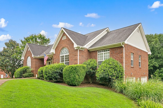 2386 Pleasant View Rd, Pleasant View, TN 37146 - view of home's exterior featuring brick siding, a yard, and roof with shingles