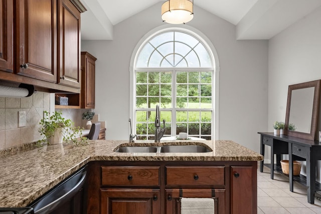 2386 Pleasant View Rd, Pleasant View, TN 37146 - kitchen featuring light tile patterned floors, tasteful backsplash, light stone countertops, dishwasher, and vaulted ceiling