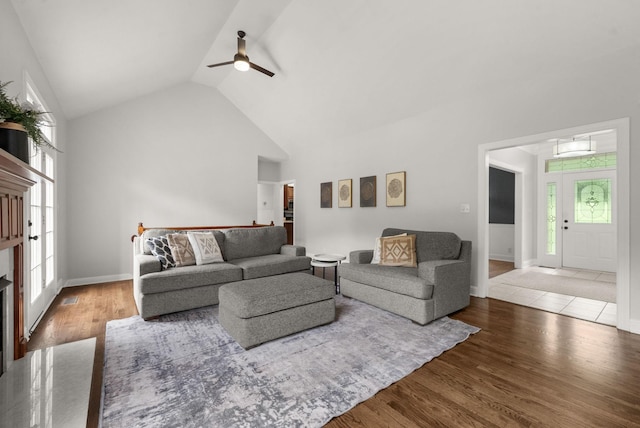 2386 Pleasant View Rd, Pleasant View, TN 37146 - living room featuring ceiling fan, wood finished floors, high vaulted ceiling, and a premium fireplace