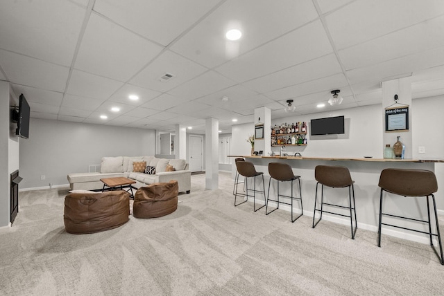 2386 Pleasant View Rd, Pleasant View, TN 37146 - living area featuring light colored carpet, bar, and a paneled ceiling