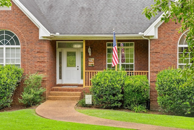 2386 Pleasant View Rd, Pleasant View, TN 37146 - doorway to property featuring a shingled roof and brick siding