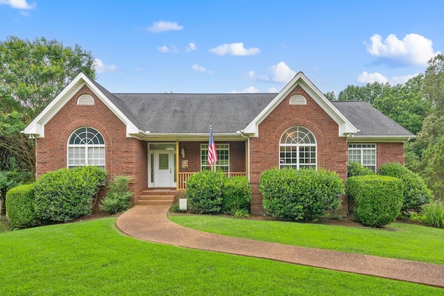 2386 Pleasant View Rd, Pleasant View, TN 37146 - ranch-style house with brick siding, a front lawn, a shingled roof, and a porch
