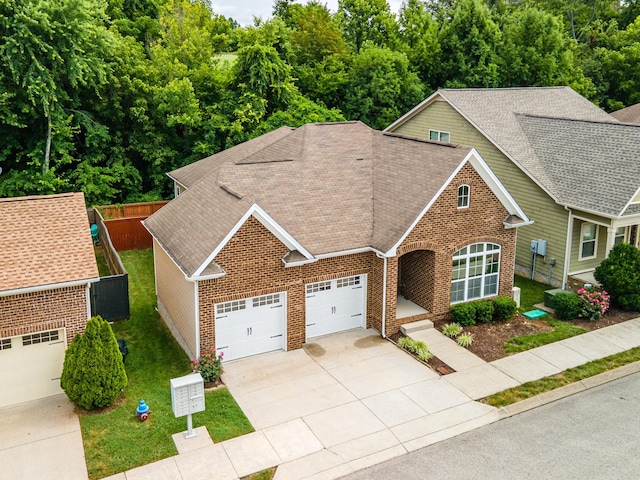 2438 Duxbury Dr, Columbia, TN 38401 - view of front of property featuring brick siding, concrete driveway, a garage, and a shingled roof