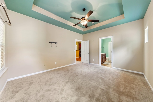 2438 Duxbury Dr, Columbia, TN 38401 - unfurnished bedroom with a raised ceiling, multiple windows, carpet floors, and ensuite bathroom