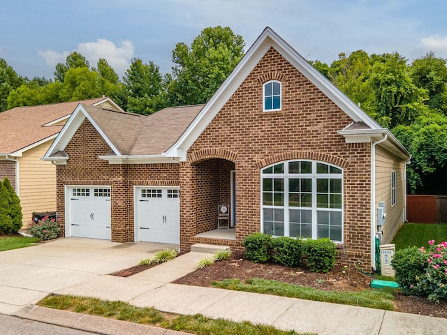 2438 Duxbury Dr, Columbia, TN 38401 - traditional home with brick siding, a garage, concrete driveway, and roof with shingles