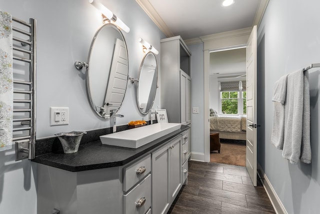 1727 Hillmont Dr, Nashville, TN 37215 - bathroom featuring vanity, crown molding, connected bathroom, wood finished floors, and a towel warmer