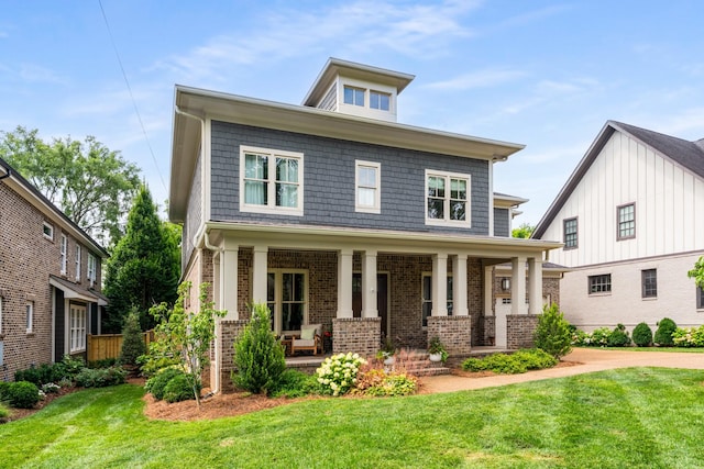 1727 Hillmont Dr, Nashville, TN 37215 - traditional style home with covered porch, a front yard, and brick siding